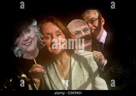 Rose Anne Kenny, TCD Professor of Geriatric Medicine and Principal Investigator of Ireland's first Longitudinal Study On Ageing (TILDA) launches the report with Donal Casey, the Chief Executive of Irish Life, at Trinity College Dublin, alongside computer generated masks of themselves aged. Stock Photo