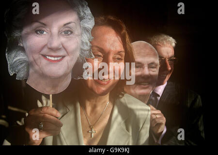 Rose Anne Kenny, TCD Professor of Geriatric Medicine and Principal Investigator of Ireland's first Longitudinal Study On Ageing (TILDA) launches the report with Donal Casey, the Chief Executive of Irish Life, at Trinity College Dublin, alongside computer generated masks of themselves aged. Stock Photo