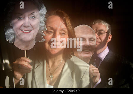 Rose Anne Kenny, TCD Professor of Geriatric Medicine and Principal Investigator of Ireland's first Longitudinal Study On Ageing (TILDA) launches the report with Donal Casey, the Chief Executive of Irish Life, at Trinity College Dublin, alongside computer generated masks of themselves aged. Stock Photo