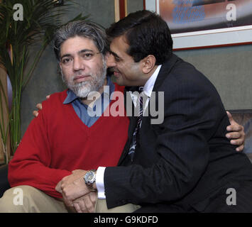 Death row Briton Mirza Tahir Hussain (left) and his brother Amjad Hussain at London's Heathrow Airport tonight Mirza spent 18 years in prison in Pakistan. Stock Photo