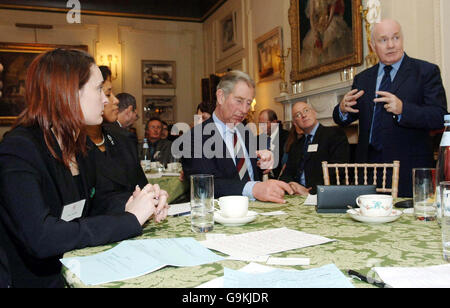 Former offender Anna Chambers (left) meets The Prince of Wales and the Home Secretary John Reid as the prince hosts 'Breaking the Cycle' - an opportunity for young offenders to meet senior members of the criminal justice system, at Clarence House in London. Stock Photo