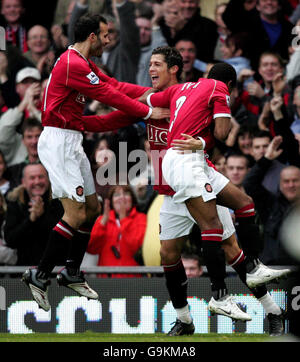 Manchester United Cristiano Ronaldo (centre) celebrates scoring the second goal against Portsmouth during the Barclays Premiership match at Old Trafford, Manchester. Stock Photo