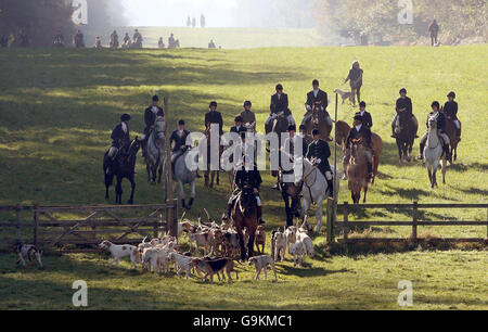 Captain Ian Farquhar leads the hounds along Worcester Avenue before they ride out from Worcester Lodge on the Badminton Estate in Gloucestershire on the first day of the fox hunting season. Stock Photo