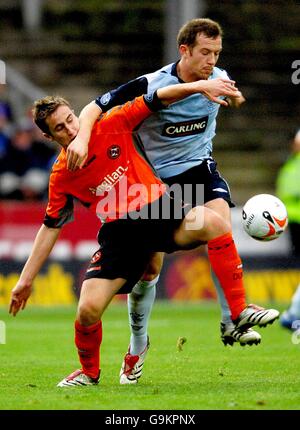 Dundee United's Greg Cameron (l) and Rangers Charles Adam battle for the ball Stock Photo