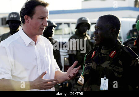 Conservative Party leader David Cameron with African Union Force Commander Luke Aprezi as he meets soldiers from the African Union Mission in Sudan who he met at El Fasher as part of two day tour to the African nation. Stock Photo