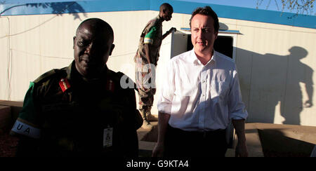 Conservative Party leader David Cameron with African Union Force Commander Luke Aprezi as he meets soldiers from the African Union Mission in Sudan who he met at El Fasher as part of two day tour to the African nation. Stock Photo