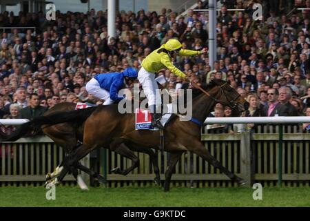 Horse Racing - Newmarket Sagitta Festival. Ameerat, ridden by Philip Robinson wins the Sagitta 1000 Guineas Stakes, beating Muwakleh ridden by Frankie Dettori into second Stock Photo