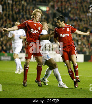 PSV Eindhoven's Rodrigo Alex (c), Liverpool's Sanz Luis Garcia (r) and Dirk Kuyt battle for the ball during the Champions League Group C match at Anfield, Liverpool. Stock Photo