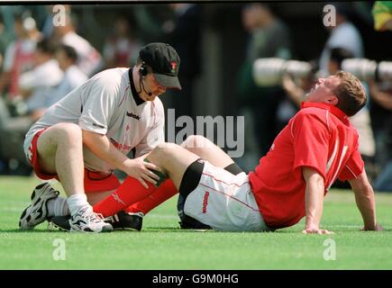 Wales' Craig Morgan receives treatment for a knee injury from physio Stock Photo