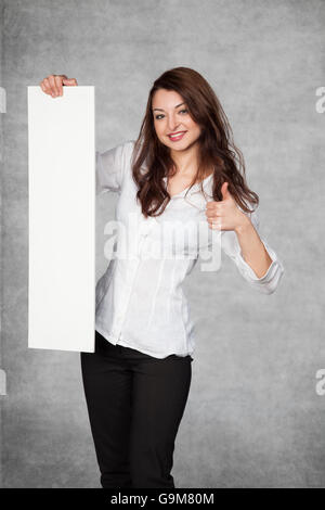 thumbs up for the location on your advertisement Stock Photo
