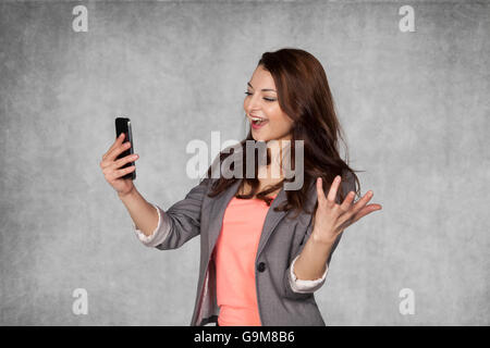 Happy business woman reading email Stock Photo