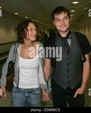 King of the Jungle Matt Wills, with his girlfriend Emma Griffiths, arrives at Heathrow Airport after winning the game show ' I am a Celebrity...Get Me Out Of Here'. PRESS ASSOCIATION Photo. Stock Photo