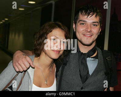 King of the Jungle Matt Wills, with his girlfriend Emma Griffiths, arrives at Heathrow Airport after winning the game show ' I am a Celebrity...Get Me Out Of Here'. PRESS ASSOCIATION Photo. Stock Photo