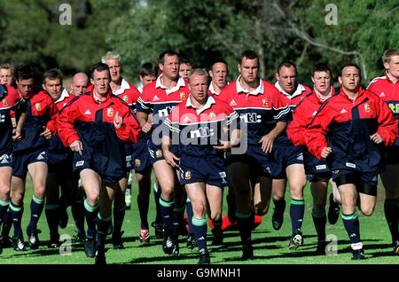 British Lions Tour 2001, Training Perth. The British Lions warm up before training at the Associates Rugby Club. Stock Photo