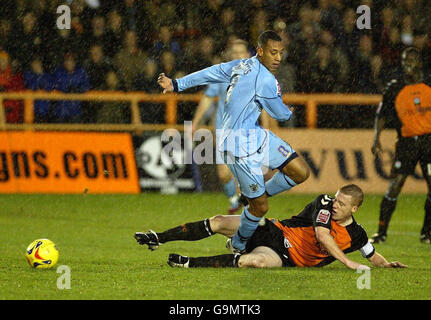 Soccer - Coca-Cola League Two - Barnet v Bury - Underhill. Barnet captain Nick Bailey (right) tackles Bury's Dwayne Mattis during the Coca-Cola League Two match at Underhill, Barnet. Stock Photo