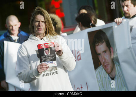 Lee Kinsella's sister Donna on the streets of Finglas in Dublin as police step up their hunt for his killer. Stock Photo