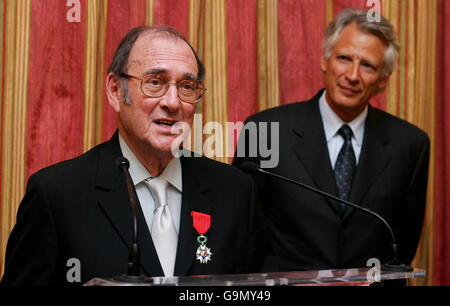 Nobel-winning British playwright Harold Pinter (left) speaks after being awarded the French Legion d'honneur by French Prime Minster Dominique de Villepin (right) at the French Embassy in London. Stock Photo