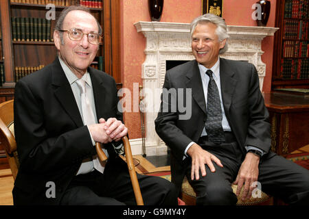 Nobel-winning British playwright Harold Pinter (left) shares a joke with French Prime Minister Dominique de Villepin (right) after being awarded the French Legion d'honneur at the French Embassy in London. Stock Photo