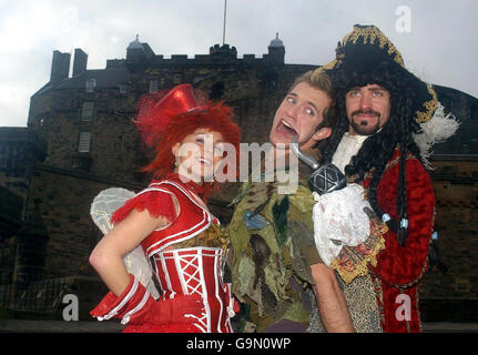 STANDALONE. Cast members from Peter Pan on Ice, (from the left) Natalie Cunningham (Tinkerbell), Julien Bouchard (Peter Pan) and Trevor Buttenham (Captain Hook), visit Edinburgh castle to promote their world tour coming to the city. Stock Photo