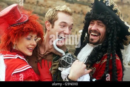 Cast members from Peter Pan on Ice, (from the left) Natalie Cunningham (Tinkerbell), Julien Bouchard (Peter Pan) and Trevor Buttenham (Captain Hook), visit Edinburgh castle to promote their world tour coming to the city. Stock Photo