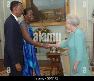 Britain's Queen Elizabeth II receives the President of Rwanda, Mr. Paul Kagame and his wife Jeannette at Buckingham Palace, London. Stock Photo