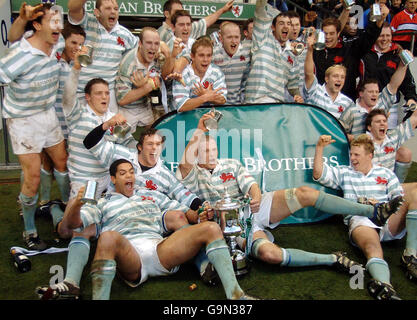 Rugby Union - Varsity match - Cambridge v Oxford - Twickenham. Cambridge celebrate with their trophy following victory over Oxford in the Varsity match at Twickenham, London. Stock Photo