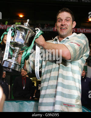 Cambridge's captain and try scorer John Blaikie celebrates with the trophy at the end of the game Stock Photo