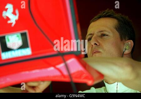 Michael Schumacher watches the lap times during practice in Montreal Stock Photo