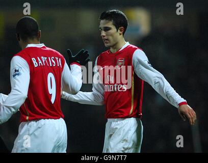 Arsenal's Robin Van Persie celebrates scoring his sides second goal of the game against Watford with Cesar Julio Baptista Stock Photo