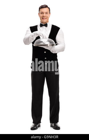 Full length portrait of a young waiter holding an empty tray with a plastic lid isolated on white background Stock Photo