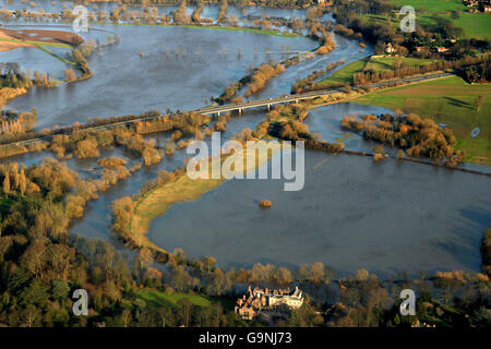 An aerial view of fields outside York where the swollen River Ouse has burst its banks due to the recent storms. Bishopthorpe Palace, the official residence of the Archbishop of York, can be seen in the bottom of the picture and the A64 Leeds to Scarborough road can be seen in the centre. Stock Photo