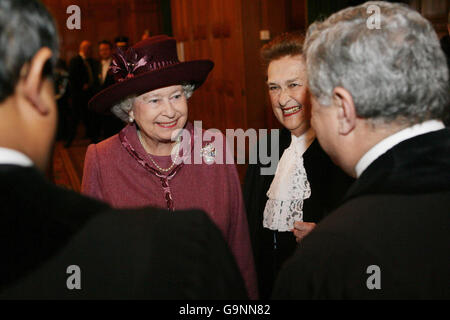 Britain's Queen Elizabeth II meets judges from the International Court of Justice (ICJ) as she is shown around by the President of the ICJ, Dame Rosalynd Higgins during a visit to the ICJ in The Hague in the Netherlands. Stock Photo