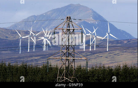 An electricity pylon at Sherrifmuir near Dunblane with the Braes of Doune windfarm in the background on the day the public enquiry begins for the proposed Beauly to Denny 400 kv Steel tower Double Circuit overhead electricity Transmission Line . Stock Photo