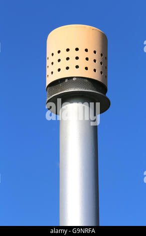 yellow vent pipe above the large pressure vessel for the storage of natural gas Stock Photo