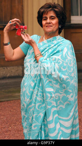 Mrs Nusrat Lilani, creator of the Asian Women of Achievement Awards, after collecting an OBE from Britain's Queen Elizabeth II at Buckingham Palace. Stock Photo