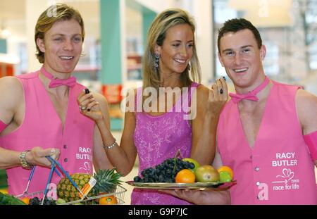 Demanding shopper Lady Victoria Hervey, centre, launches a free personal butler service at a Tesco store in west London with the help of Chris Ellis-Stanton, left, and Scott Elliott, right. Stock Photo
