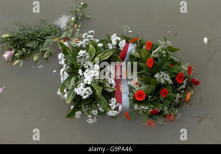 A floral tribute from the people of Zeebrugge floats by the end of a pier in Dover following a service commemorating the 20th anniversary of the Zeebrugge ferry disaster. Stock Photo