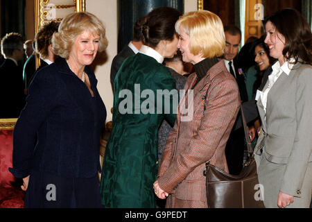 The Duchess of Cornwall (l) and the Princess Royal (centre) at a Women in Business Reception at Buckingham Palace today, Valentine's Day. Stock Photo