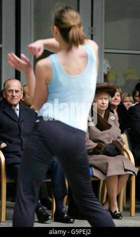 Britain's Prince Philip, the Duke of Edinburgh, (left) and Queen Elizabeth II watch a dance demonstration during a visit to Millwall Fire Station in London's docklands. Stock Photo