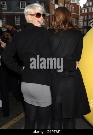 Sarah Harding from Girls Aloud hugs bandmate Kimberley Walsh during a photocall to launch the Variety Club Gold Heart Appeal, at Harrods in central London. Stock Photo