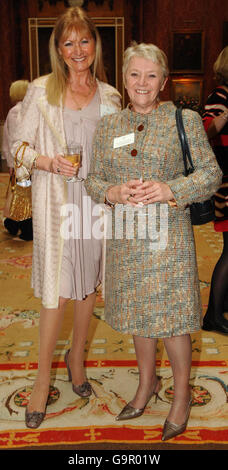 Debbie Moore, founder and chairman of Pineapple Holdings (left) and Dianne Thompson, chief executive of Camelot Group at Buckingham Palace in London, for a Woman in Business reception. Stock Photo