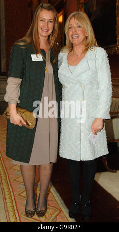 Anya Hindmarch, fashion designer (left), and Sarah Doukas, founder of Storm Model Management, at Buckingham Palace in London for a Woman in Business reception. Stock Photo