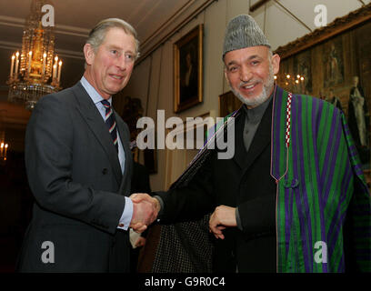 Britain's Prince Charles (left) greets President Hamid Karzai of Afghanistan at London's Clarence House. Stock Photo