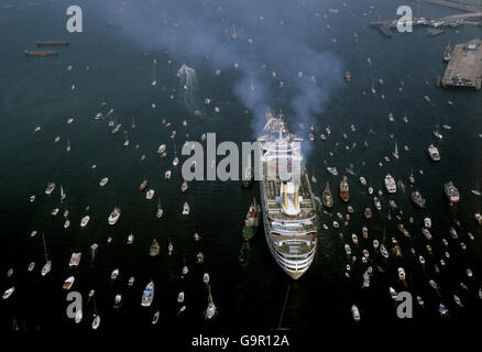 An Armada of smaller boats escorts the P&O liner, Canberra up Southampton Water on her return from the Falklands conflict with Falkland Task Force troops. Stock Photo