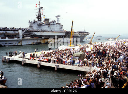 The Falklands task force flagship HMS Hermes docks at Portsmouth on her return from the South Atlantic. Stock Photo