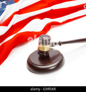 Close up shot of a judge gavel near flag of Unites States of America Stock Photo