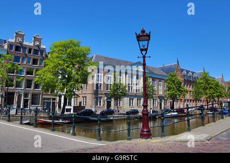 Street scene with lamppost and canal in Amsterdam, Holland Stock Photo