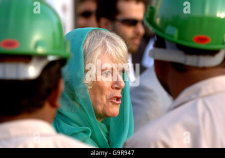 The Duchess of Cornwall wears a green headscarf, as she talks to construction workers during a tour of the Sheik Zayed Mosque, which is being built in Abu Dhabi, after her arrival with the Prince of Wales in the Gulf State this afternoon. Stock Photo