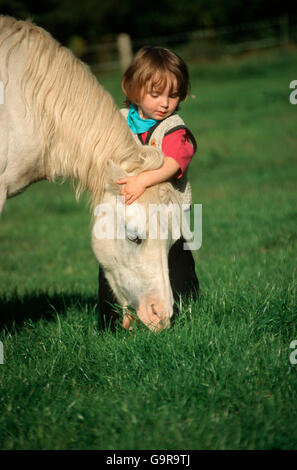 Toddler with Welsh Mountain Pony / Welsh Pony section A Stock Photo