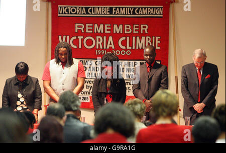 A one minute silence at a series of Lectures in central London about the death of Victoria Climbie who was eight and would have been 16 this year, and was found with 128 separate injuries when she died in February 2000. Stock Photo